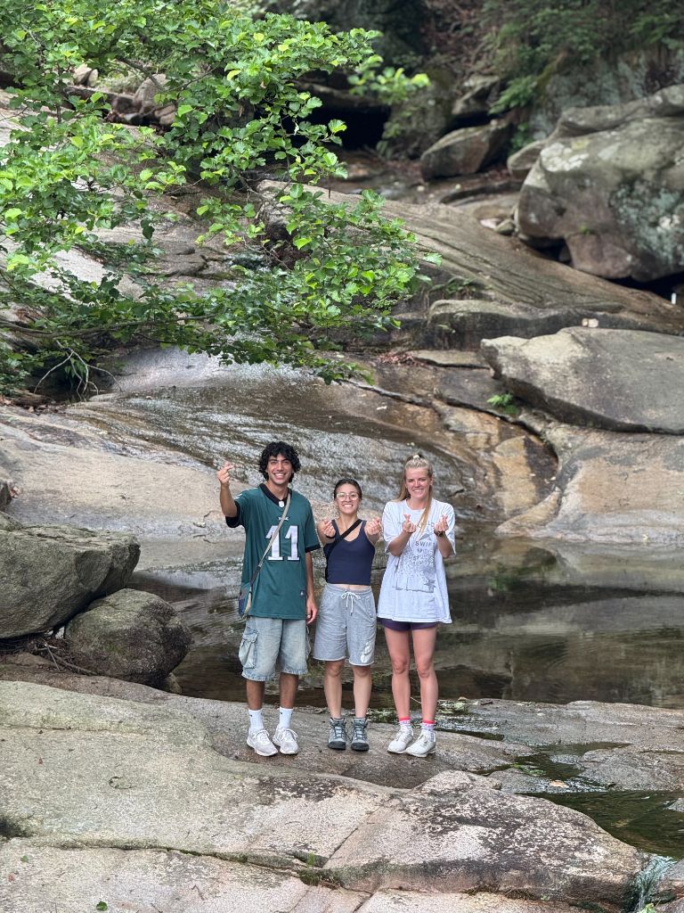 Group at rocky stream