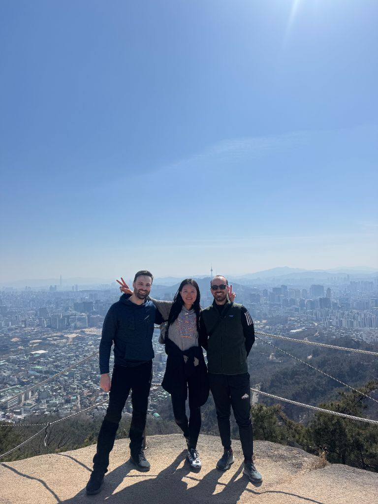 Group overlooking Seoul from Bugaksan City Wall