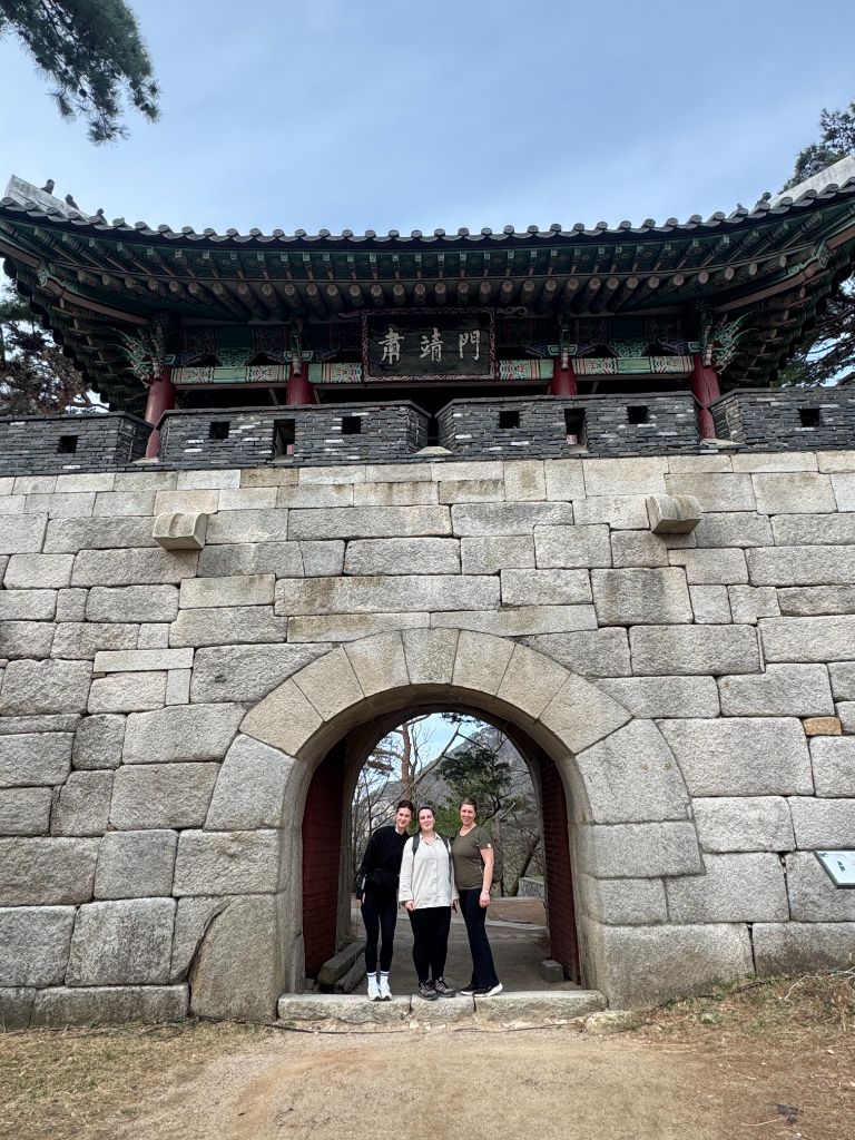 Group at historic fortress gate on city wall