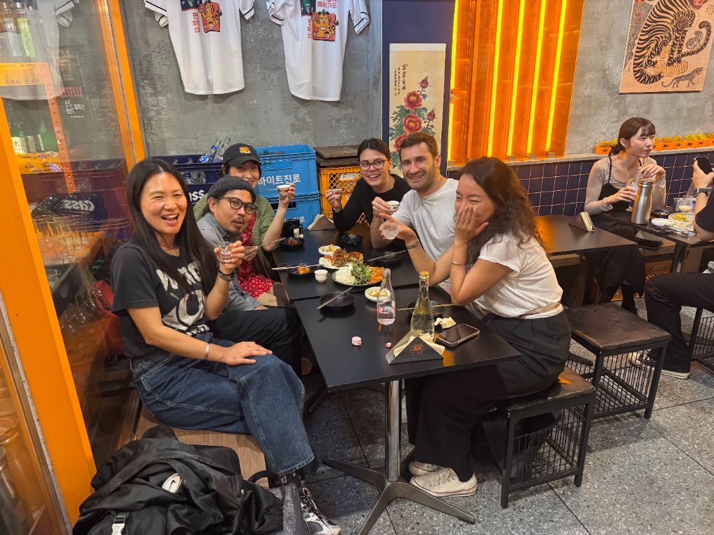 Group enjoying Korean food and drinks