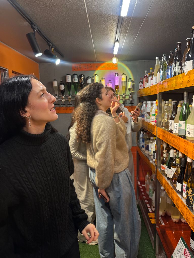 Guests browsing traditional liquor shop