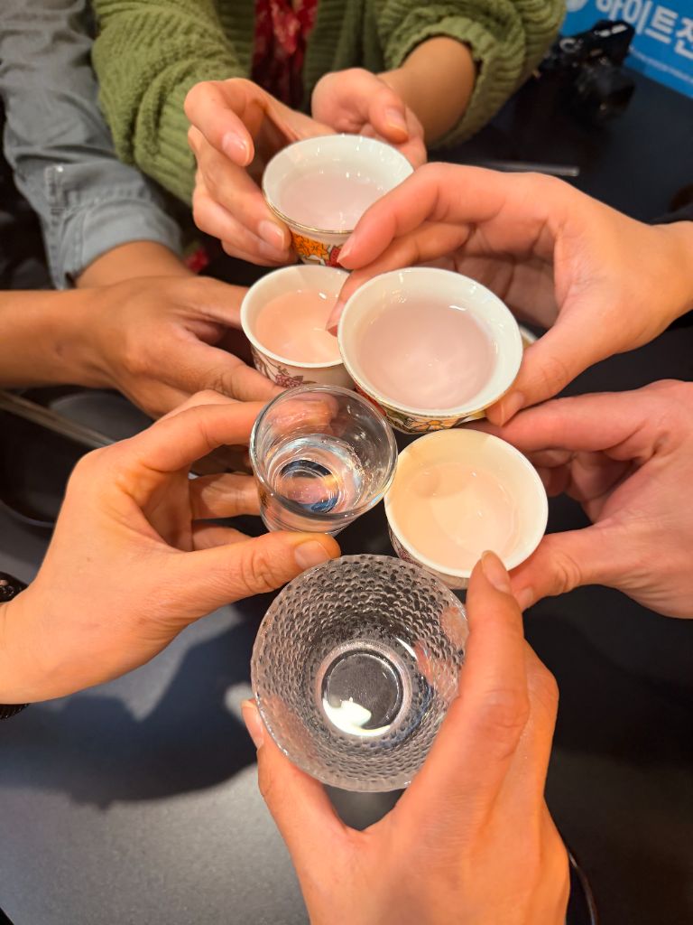 Traditional makgeolli cup cheers