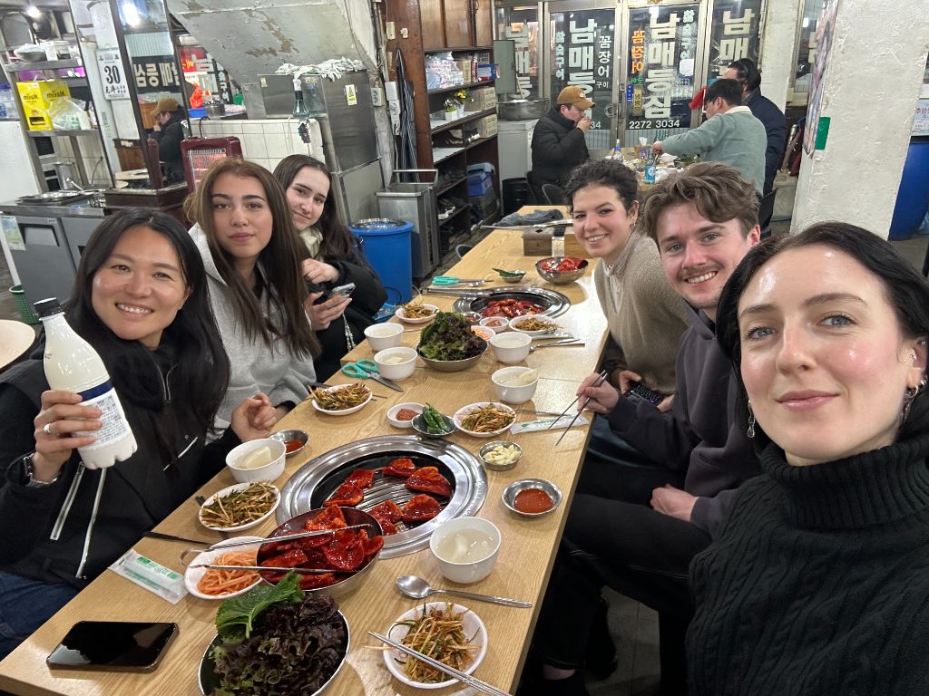 Group at Gwangjang Market with makgeolli
