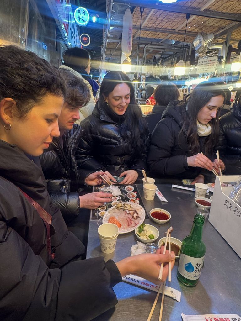 Guests at market counter with soju