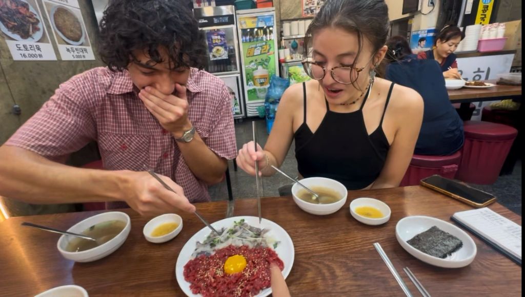 Guests trying yukhoe raw beef tartare