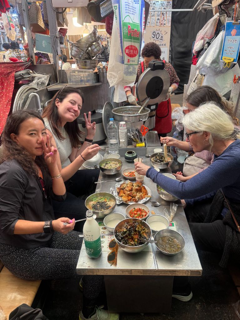Guests enjoying Korean food at restaurant