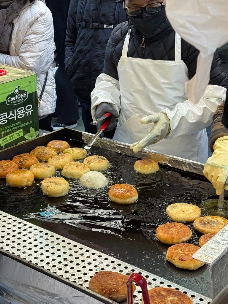 Hotteok being freshly cooked at market