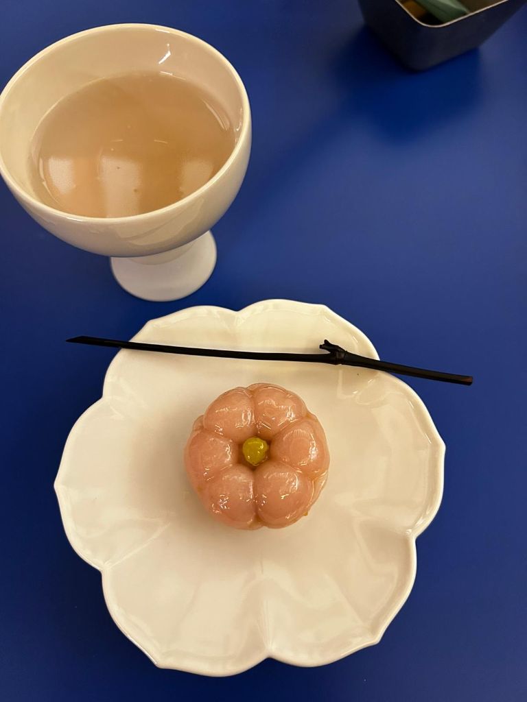 Pink flower tteok on white plate
