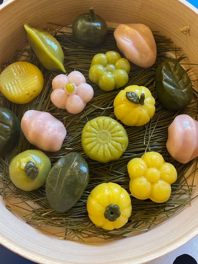 Two plates of colorful tteok